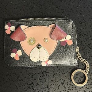 Kate Spade coin purse. Maroon color with adorable dog face and flower details.